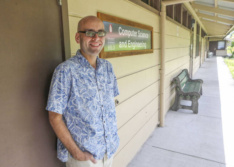 Kelsey Walling/Tribune-Herald UH-Hilo professor Travis Mandel stands for a photo Wednesday outside the Department of Computer Science and Engineering.
